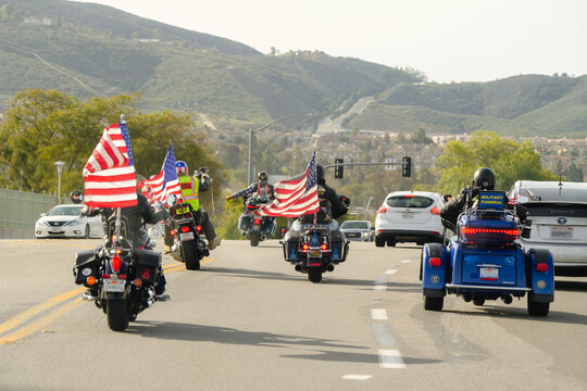 Patriot Guard Motorcycles with Flags on Highway