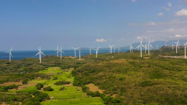 Aerial drone of Wind turbines on the coastline. Wind power plant. Philippines.
