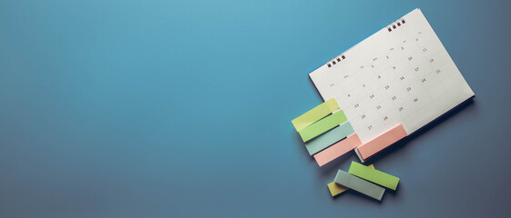 Fototapeta premium Closeup calendar page with drawing-pins , planning for business meeting or travel planning concept