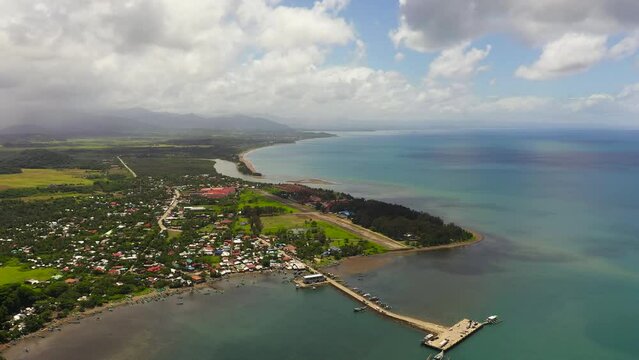 A town on the seashore with a port and a pier. Luzon, Santa Ana, Cagayan. Philippines.