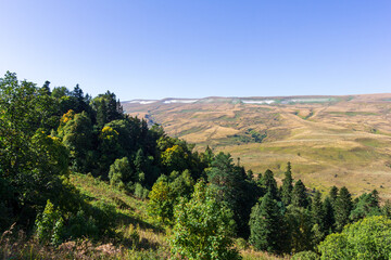 mountainous terrain, shallow river, sunny morning, autumn walks in the bosom of nature, the state of nature with the approach of winter.