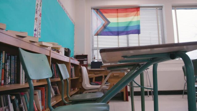 Pride and inclusion in modern classrooms - LGBTQ flag on the wall of a school