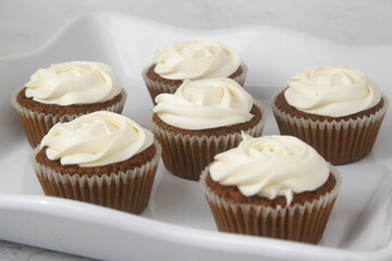 Freshly baked cupcakes with icing