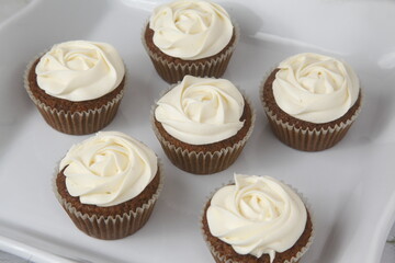 Freshly baked cupcakes with icing