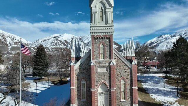 Aerial Brigham City Utah LDS Tabernacle winter. The Church of Jesus Christ of Latter-day Saints, LDS or Mormon Church. Spiritual sacred church. Urban neighborhood in mountain valley. Winter snow.
