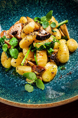 Freshly prepared gnocchis with sage  and mushrooms