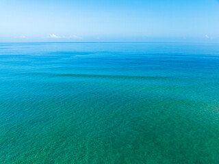 Obraz premium Beautiful sea water surface Blue sky background. Bird's eye view sea landscape nature background