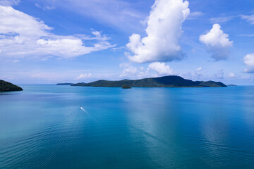 Aerial view summer sea in sunny day with long-tail fishing boat,Beautiful clouds blue sky background