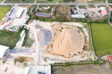 Pile of sand and rock or gravel in site, concrete plant in aerial view. Heap of aggregate or material from nature, mine or quarry for mix with cement, concrete. Builder using in industry construction