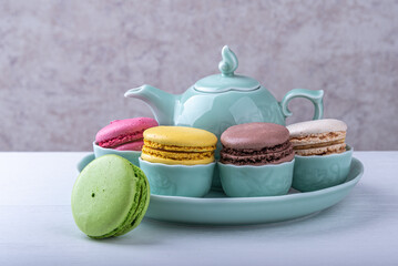 Sweet delicate multi-colored macaroni cakes on the table.