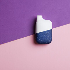 disposable electronic cigarette or vape on purple background. top view copy space. nicotine vapor stick. bad addiction and artificial nicotine. square