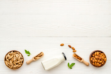Fototapeta na wymiar Vegan non dairy drink - sweet almond milk with nuts