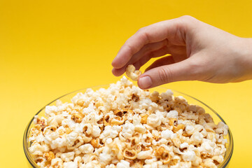 Female hand with popcorn