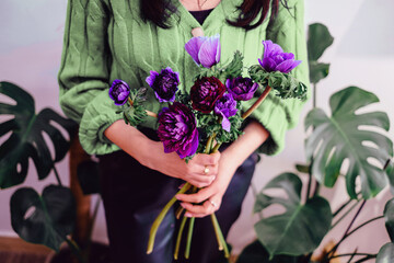 Small business flower shop florist hands with a bouquet.
