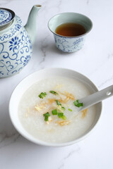 Chinese New Year homemade breakfast meal. Chicken Congee with Turnip Cake aka Lo Bak Go. Delicious and healthy with good synonyms and homonyms meanings