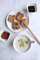 Chinese New Year homemade breakfast meal. Chicken Congee with Turnip Cake aka Lo Bak Go. Delicious and healthy with good synonyms and homonyms meanings