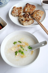 Chinese New Year homemade breakfast meal. Chicken Congee with Turnip Cake aka Lo Bak Go. Delicious and healthy with good synonyms and homonyms meanings