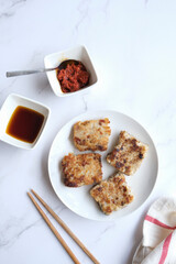Cantonese favourite dish during Chinese New Year. Turnip Cake aka Lo Bak Go. Made from sliced or diced radish, rice flour, dried shrimps, chinese mushrooms and chinese sausage.