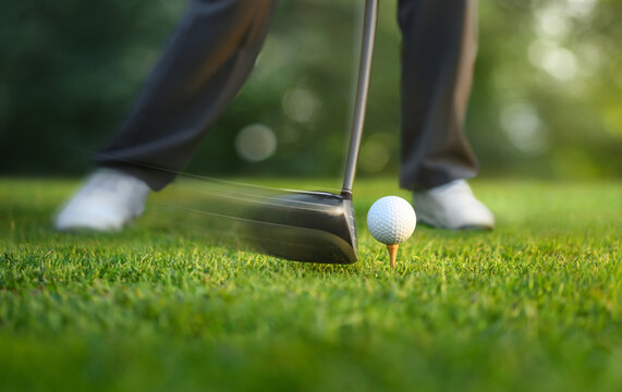 Motion action of teeing off golf ball with drivers.