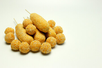 Corn dog and breaded mozzarella cheese Balls, traditional korean street food. Isolated 