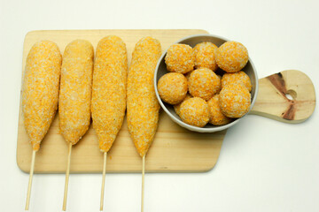 Corn dog and breaded mozzarella cheese Balls, traditional korean street food. Top view