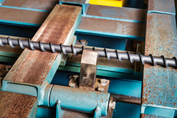 A metal rod heated in an induction furnace after processing. Hot metal cools down. Metalworking in...