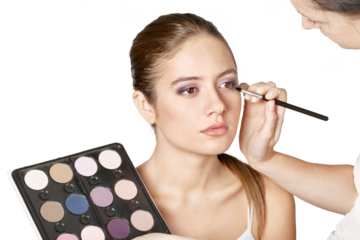 Professional makeup artist doing makeup girl