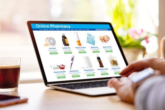 Woman using laptop and shopping for medical products on pharmacy online store