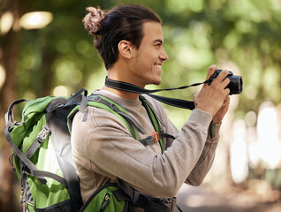 Photography man, camera and outdoor park with smile, focus or adventure with creative vision. Young...