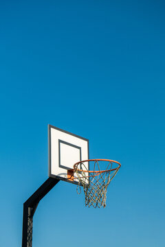 Street basketball hoop on background of vibrant sky. Creative minimalistic photo. Street Basketball Loop Basket Outdoors Abstract sport wide blank empty background texture, copy space. Sports