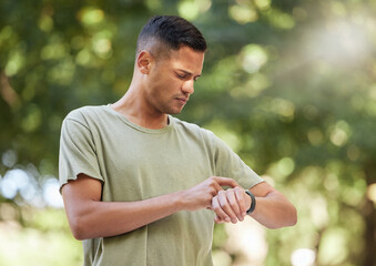 Fitness, time and man with watch in nature to check heart, running progress and notification....