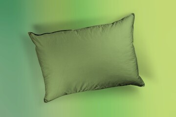 Green color Fabric Pillow on desk