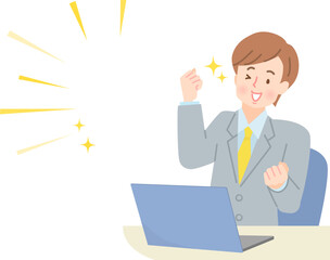 パソコンの画面を見てガッツポーズする若い男性