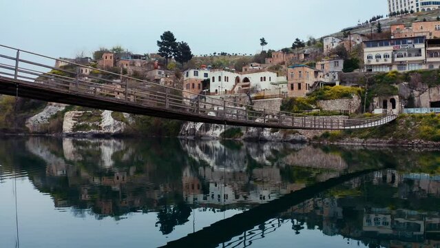 The suspension bridge over the Euphrates in Halfeti. Sanlıurfa , Turkey. 4K