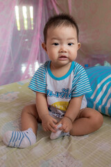 Asia Cute baby playing in bedroom
