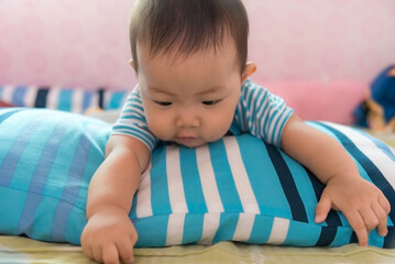 Asia Cute baby playing in bedroom