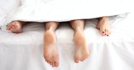 Loving couple has sex on bed in bedroom