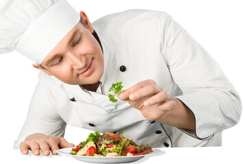 Portrait of a male chef cook preparing salad  isolated on a white background