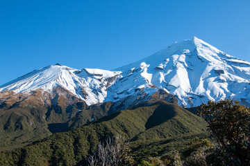 Winter view of Mt Taranaki and Fantham's Peak in Egmont National Park, New Zealand, viewed from the Waingongoro Track