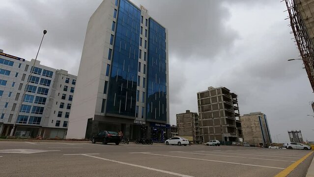Karachi, Pakistan - : Time lapse shot of Cityscape, landmarks of Karachi, Bahria Tower, Dolmen mall Clifton, Karachi, sea view