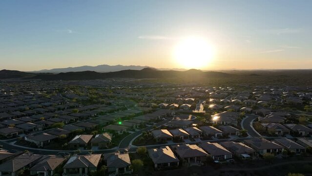 Wide drone shot of the Vistancia planned community under Arizona's setting sun.