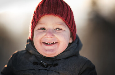 portrait of handsome smiling boy with winter background