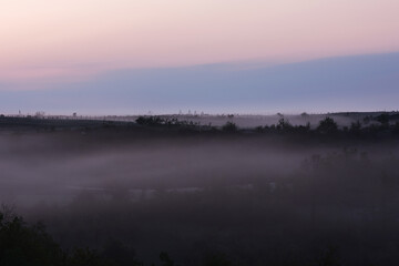 Fototapeta na wymiar spring scenery,morning foggy landscape in northeastern Bosnia