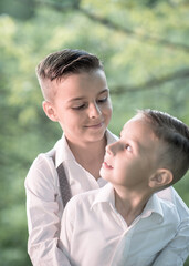 Fototapeta premium handsome boy portrait,two brothers stand hugging