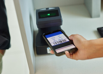 Hands, phone and ticket scan at airport for travel, immigration or transport service by terminal. Hand of traveler scanning smartphone online boarding pass, barcode or permit on mobile flight app