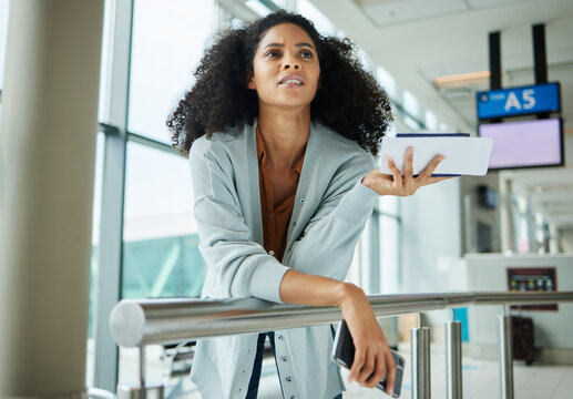 Black Woman, Ticket And Confused At Airport Waiting For Travel, Departure Or Business Trip. African American Female Traveler Holding Document, Boarding Pass Or Phone In Missed Airline Or Flight Delay