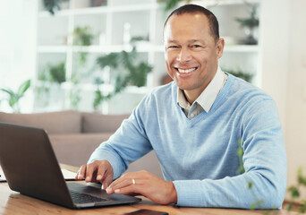 Fototapeta premium Portrait, laptop and man with remote work from home, entrepreneur and smile for success, growth and website launch. Face, male leader and business owner in lounge, happiness, deal and new project