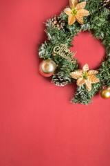 Christmas wreath on red