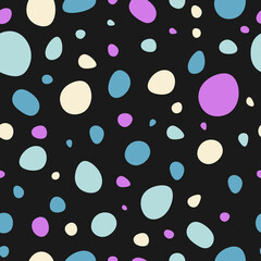 Colorful polka dots seamless pattern isolated on black background.