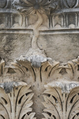 details of the capital of the columns on the ruins of a Greek temple with a beautiful marble carving, the history and heritage of ancient civilizations in the Aegean region of Turkey, vacation travel